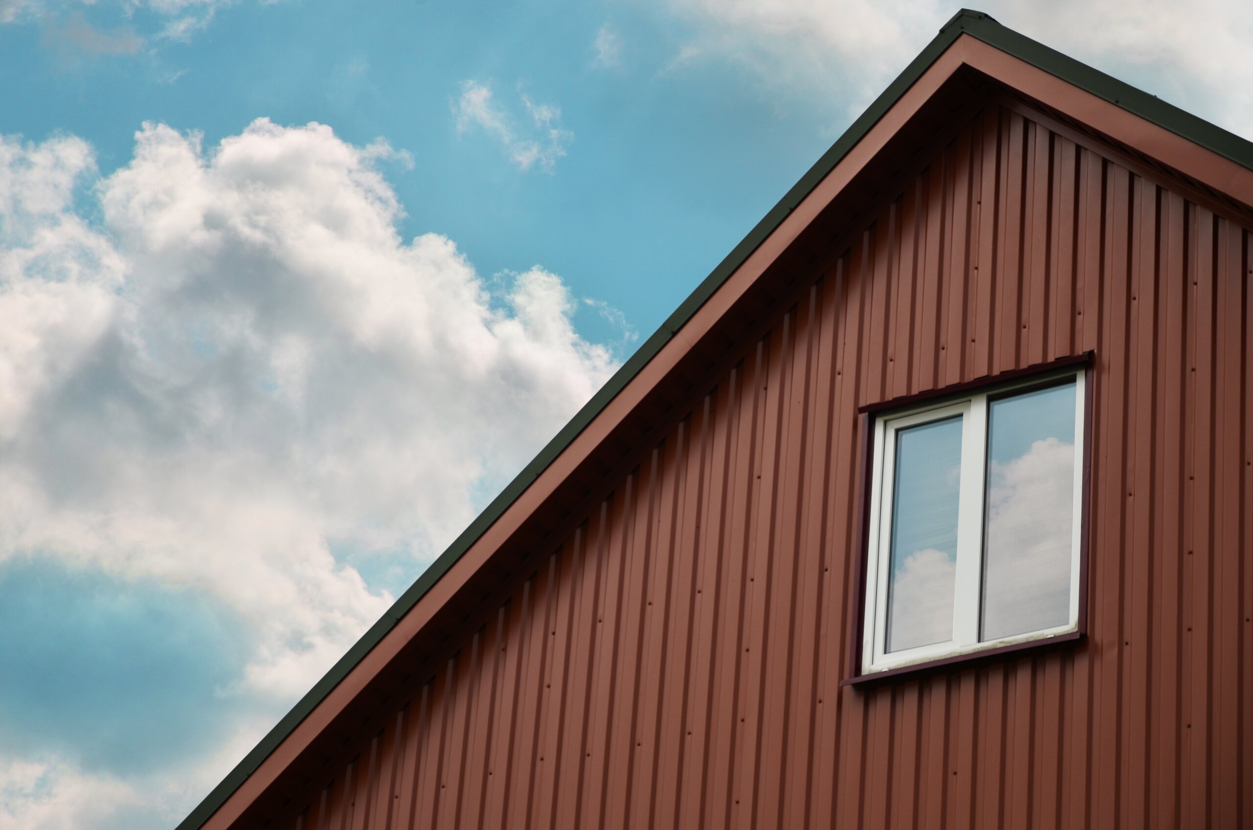 Attic with a small window siding styles