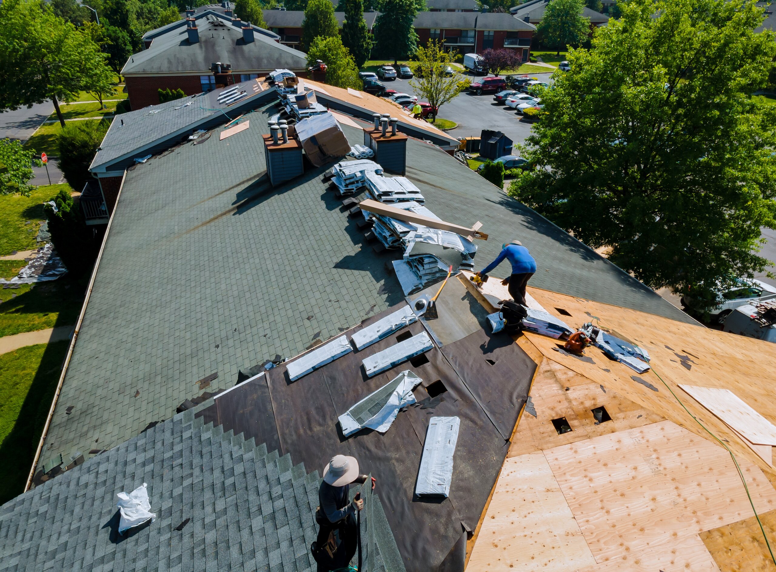 Construction worker on renovation roof the house installed new shingles Construction worker on renovation roof the house installed new shingles